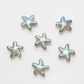 Macro shot of 6 iridescent starfish glass beads with AB coating for DIY jewelry - Pack of 30 / Transparent Green