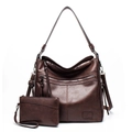 Detail of dark brown pebble leather tote bag with functional zippers and matching clutch bag - Two-Piece Set / Coffee