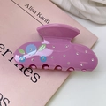 Detail of purple acetate hair claw clip with floral patterns and sparkling rhinestones - Pink