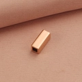 Polished rose gold hollow rectangular pendant on textured pink fabric background - 5*12MM / Rose Gold