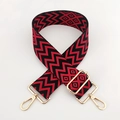 Close-up of black and red wavy geometric pattern bag strap with gold metal buckles - Gold Buckle / Black Red