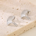 Silver ginkgo leaf stud earrings in brushed finish on a natural stone background - Steel Color (KE114950-KFC)