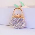 Golden handbag keychain pendant with colorful rhinestones and sparkling metallic finish - Colorful