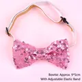 Close-up of pink sequined bow tie with an adjustable elastic strap for pet birthdays - Sequin Bow Tie / Pink