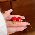 Red matte bead earrings with gold Chinese character Fa and Cai pendants held by hand - 15# Silver Needle - Red Characters