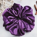 Oversized dark purple velvet hair scrunchie with soft sheen on marble surface - Purple