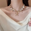 Bohemian gold starfish necklace with irregular pearls and shell beads worn by model - Irregular Shell Starfish Tassel (19#)