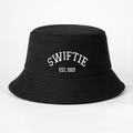 Close-up of white SWIFTIE and EST. 1989 embroidery on a black cotton canvas bucket hat - One Size / Black
