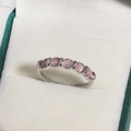 Elegant silver ring featuring seven round pink cat eye stones in a velvet jewelry box - Seven Pink Cat's Eye Stones Row Style (白金色13)