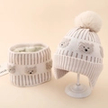 Detailed knit texture and soft plush lining of the toddler bear hat and scarf set - Beige