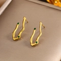 Close-up of irregular wave fluid art gold earrings inlaid with green zircon accents - Gold Irregular Wave Green Zircon (E-220)