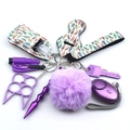 Detailed set of purple neoprene self-defense keychain accessories with feather patterns - Pink Feather
