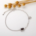Detail of S925 silver bracelet featuring red square gemstone and heart charm detail - White Gold Plated Natural Garnet