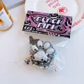 Cat paw stress relief toy in black with pearls and glitter, sized 7x6x3.5cm and 78g - Black & White Paw Print