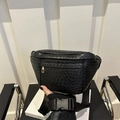 Classic black woven leather belt bag with Intrecciato texture for a stylish winter look - Black