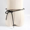 Punk style black waxed rope waist belt with silver metal rings on a beige mannequin - Black Silver