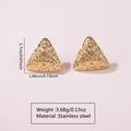 Macro shot of gold triangular stainless steel earrings with textured hammered finish - Stainless Steel Hammered Triangle Studs