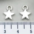 Silver star pendants for DIY jewelry making shown with a ruler for size reference - Small Pentagram 9x12mm