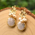 Baroque pearl earrings in gold finish featuring floral metal accents and natural pearls - Three Flowers Pearl Earrings