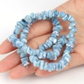 Hand holding irregular blue shell beads strand for DIY jewelry making accessories - Irregular Grey Blue