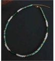 Detail of bohemian handmade necklace featuring green beads and golden metal spacers - Dark Green and Milky White Beaded / 38+5cm