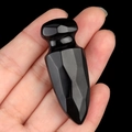 Polished black obsidian gemstone dagger carving held in hand for size reference - Obsidian