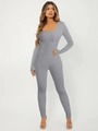 Detail of grey long sleeve ribbed jumpsuit showing high-elasticity fabric and slim fit design - S / Light Gray
