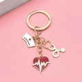 Golden keychain with medical enamel charms: white nurse hat, stethoscope, and red heart - EKG 3-Piece Set Keychain
