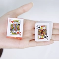 Miniature red playing card deck held in hand showing portable travel size - Red Mini Poker