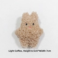 Detailed view of light coffee plush rabbit brooch made of soft curly lamb fleece fabric - Brooch Style / Light Brown Bunny