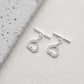 Detailed macro view of 14K silver plated OT toggle heart clasp with pave zircon stones - Style E Heart Zirconia / Silver