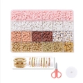 DIY jewelry kit detail featuring clay beads, letter beads, scissors, and elastic cord - Style 8 Pink & White Tones Set