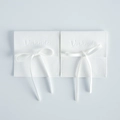 Minimalist white microfiber suede jewelry pouch with ribbon tie and embossed logo - 9x9cm / White