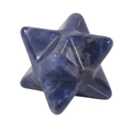 Macro detail of polished dark blue natural crystal stone Merkaba star pendant - Blue Sodalite