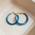 Macro detail of Klein blue resin hoop earrings with pearlescent marble texture and gold posts - Thin Style (Diameter 3.8cm) / Blue