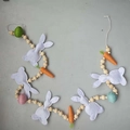 Detail of Easter bunny garland with purple felt rabbits and woven carrots on grey background - Bunny Egg & Carrot Garland (130cm)