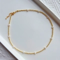 Elegant gold chain necklace with small irregular white pearls on ceramic tray - Gold Fine Beads with White Small Pearls (ZZX220045A)