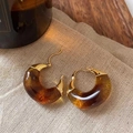 Close-up of amber resin C-shaped hoop earrings with gold metal clasp on beige fabric - Gold Clasp Amber Translucent C-Hoop Earrings (47# Silver Earring Post - Gold - Brown)