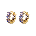 Detailed macro view of S925 silver needle hoop earrings with blue cubic zirconia flowers - Blue