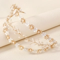 Close-up of golden baroque headband with intricate white flowers and pearls detail - Gold Flower Pearl