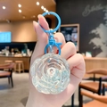 Roze beer sleutelhanger met blauwe clip en glitterzand in bloemvorm - Kleine Rozenbloem / Blauw