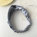 Elegant silver grey satin knot headband with elastic band on a vintage background - Blue Grey