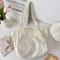Detail of floral chiffon tote bag with seersucker texture and soft interior styling - Floral Beige