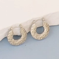 Detailed view of irregular hammered texture on geometric C-shaped hoop earrings - Silver Style K7-79