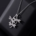 Silver-plated dragonfly necklace with zircon pavé stones on a premium display - Style N-Silver Three Connected Dragonflies
