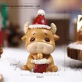 Christmas cow resin figurine wearing red santa hat and socks on snowy background - Resin / Calf - Kraft Box (7116R-12)