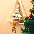Decorative Christmas gnome plush holding a woven fruit basket on a wooden swing shelf. - Santa Claus