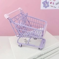 Purple mini metal shopping cart organizer on white books with a pink aesthetic background - Medium Purple Shopping Cart 13.5*9.5*15cm