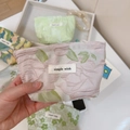 Close-up of floral jacquard canvas mini pouch with secure zipper and woven label - Green Leaf Pink Jacquard