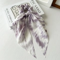 Detailed view of a purple and white tie-dye chiffon scrunchie with long ribbon streamers - Tie-dye Purple Ribbon
